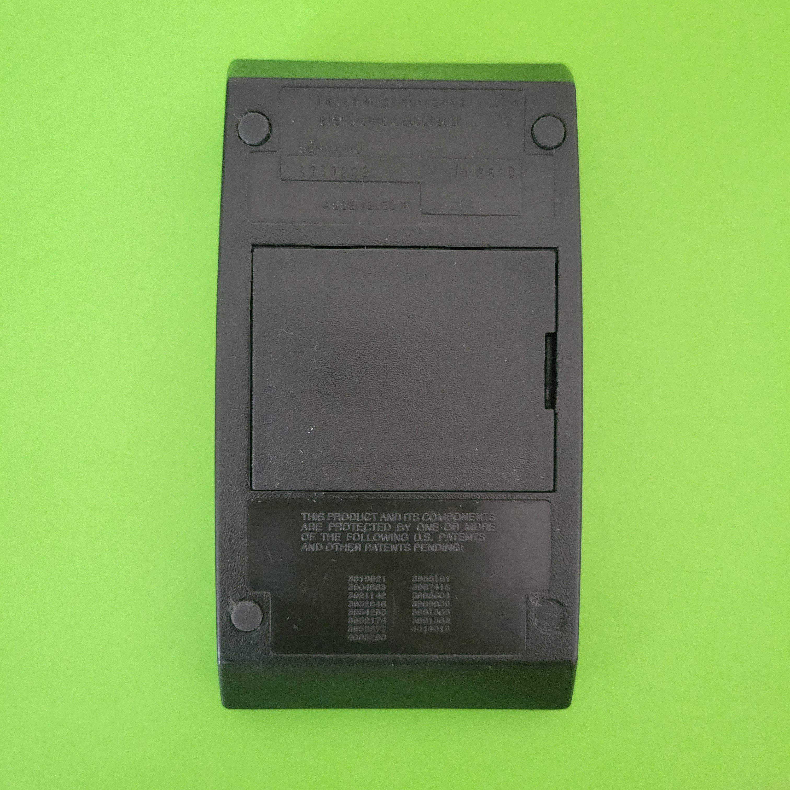 An image of the back of a texas instruments ti55 scientific/engineering calculator